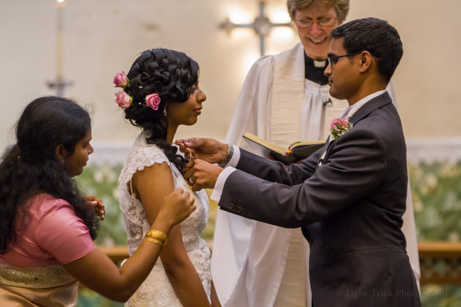 groom gives bride a Thali necklace - Sri Lankan tradition